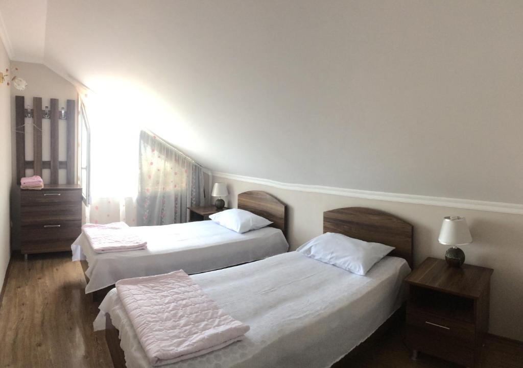 Postel nebo postele na pokoji v ubytování Mari Guest House