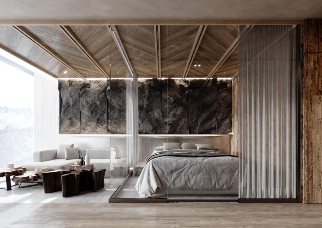 a bedroom with a bed and a living room at Giewont View Sośnica Residence & Spa in Zakopane