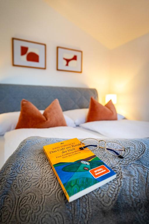 a book sitting on top of a bed at S Apartment in Flachau