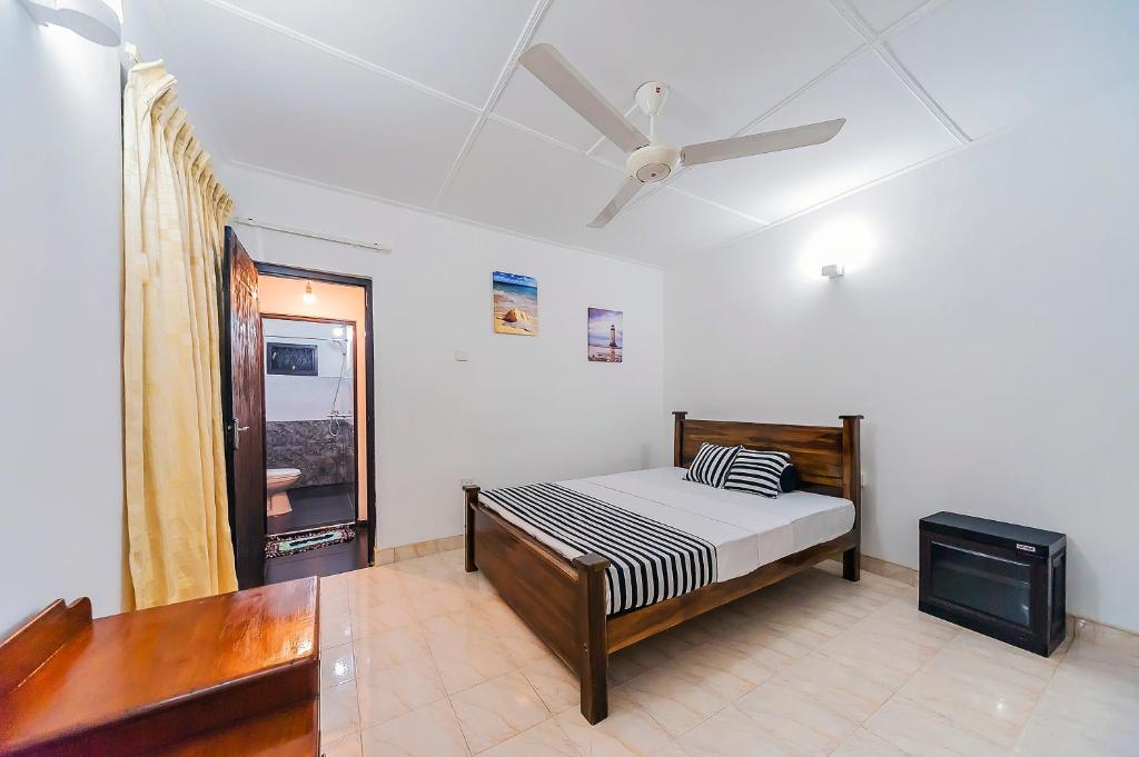 Postel nebo postele na pokoji v ubytování Cloud Inn Kandy Homestay