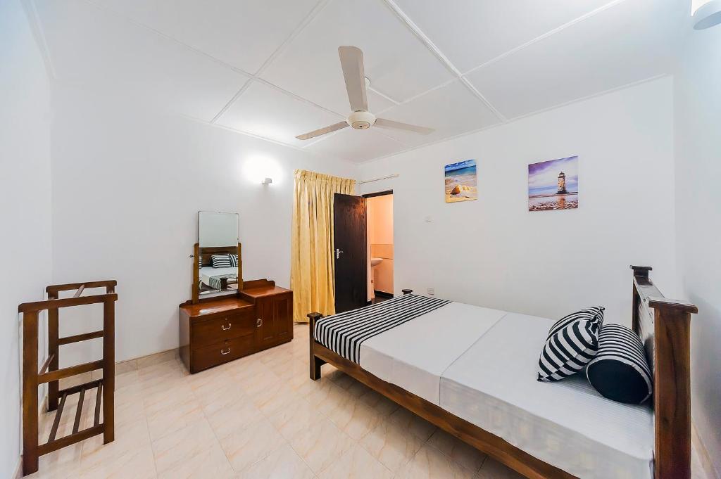 Postel nebo postele na pokoji v ubytování Cloud Inn Kandy Homestay