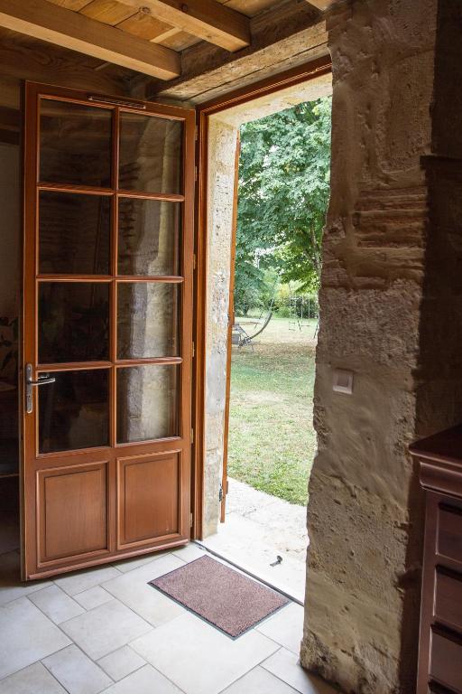 an open door of a house with a door at La Métairie du Clos Saint Louis in Montréal