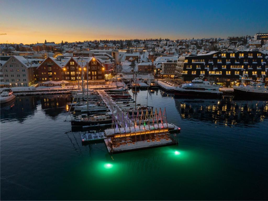 a harbor with boats in the water at night at Roestbakken Horizon in Guleng