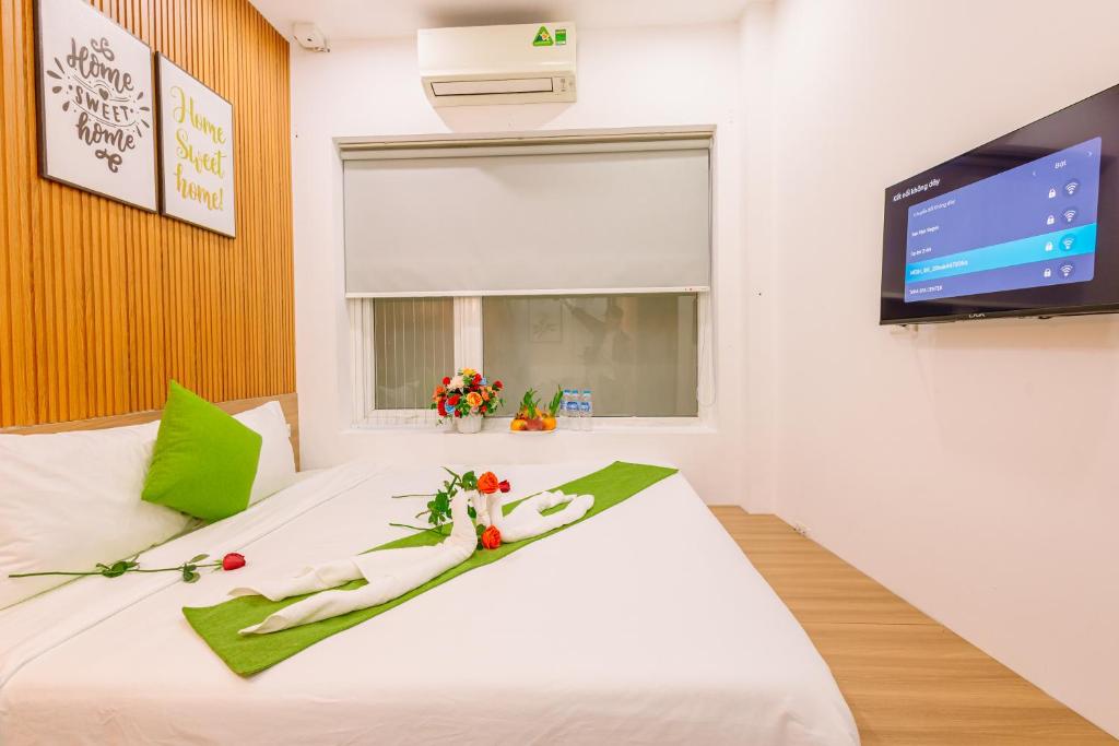 Ένα ή περισσότερα κρεβάτια σε δωμάτιο στο Hanoi Grand Sun Hotel