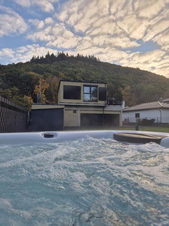 a house with a television on top of a house at Luxuscontainer am Nürburgring #2 in Adenau