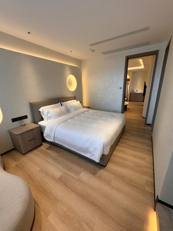 Ένα ή περισσότερα κρεβάτια σε δωμάτιο στο Dejia Hotel