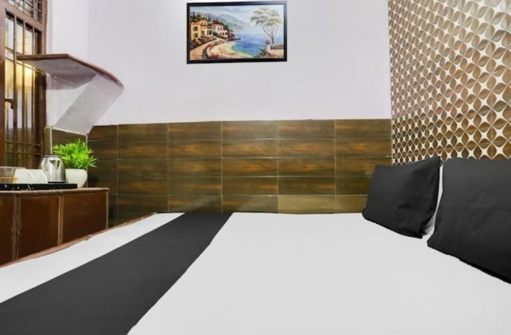 Ένα ή περισσότερα κρεβάτια σε δωμάτιο στο Hotel Bali Inn