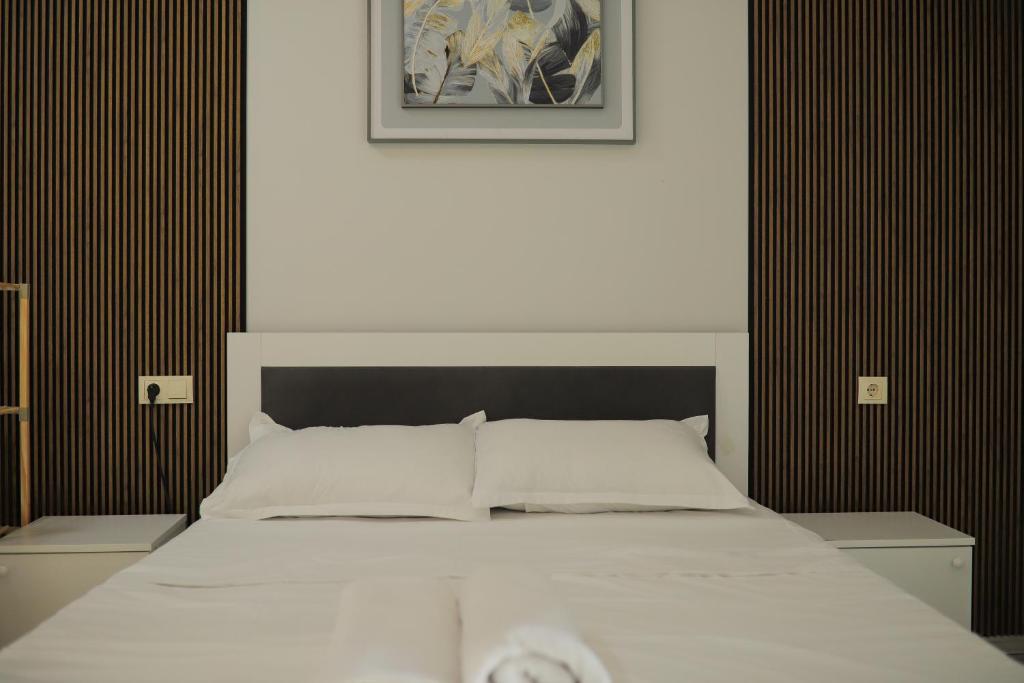 Postel nebo postele na pokoji v ubytování Despina Skyline