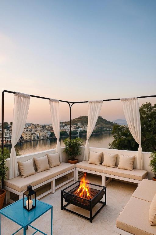 a living room with couches and a fire pit at Turtle Hostel Udaipur- 10 mtr from Lake in Udaipur