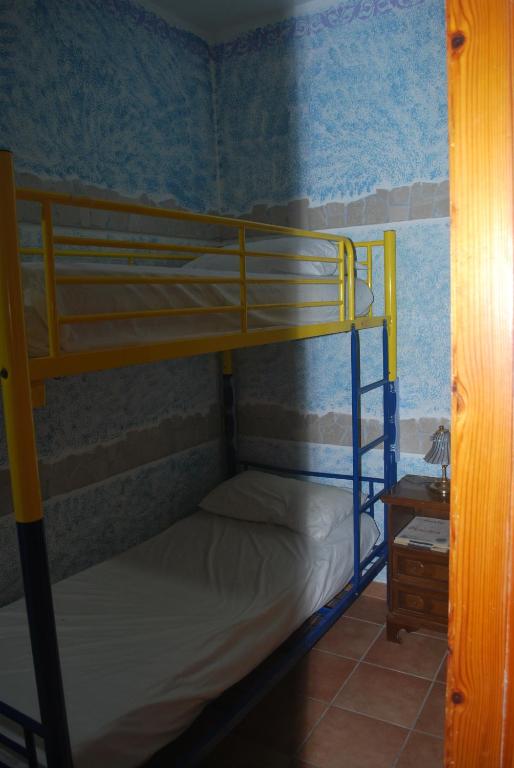 a bedroom with two bunk beds in a room at Appartamento Elena in Caramanico Terme