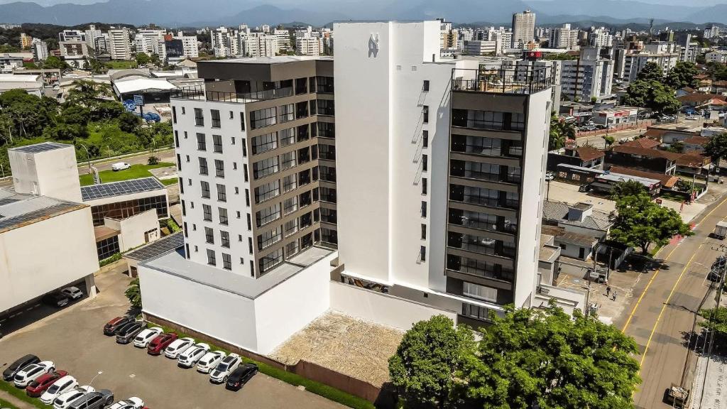 an aerial view of a white building with a city at Studio H Residencial Flipchave STH000 in Boa Vista