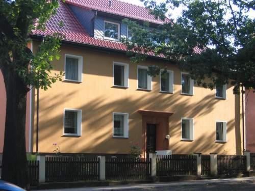 a house with a fence in front of it at FEWO Caro in Nordhausen