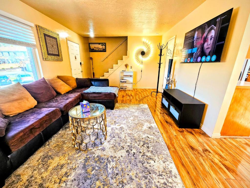 a living room with a couch and a table at Spacious Ski Base Near The Best Resorts in Salt Lake City