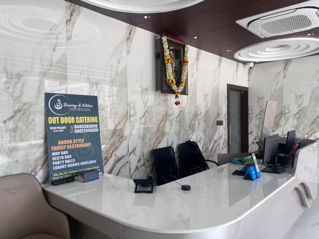 a meeting room with a large white table and chairs at Hotel The Novelty in Kānpur