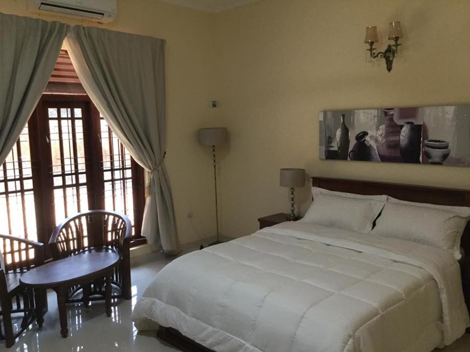 En eller flere senge i et værelse på Philanka Suites Bentota