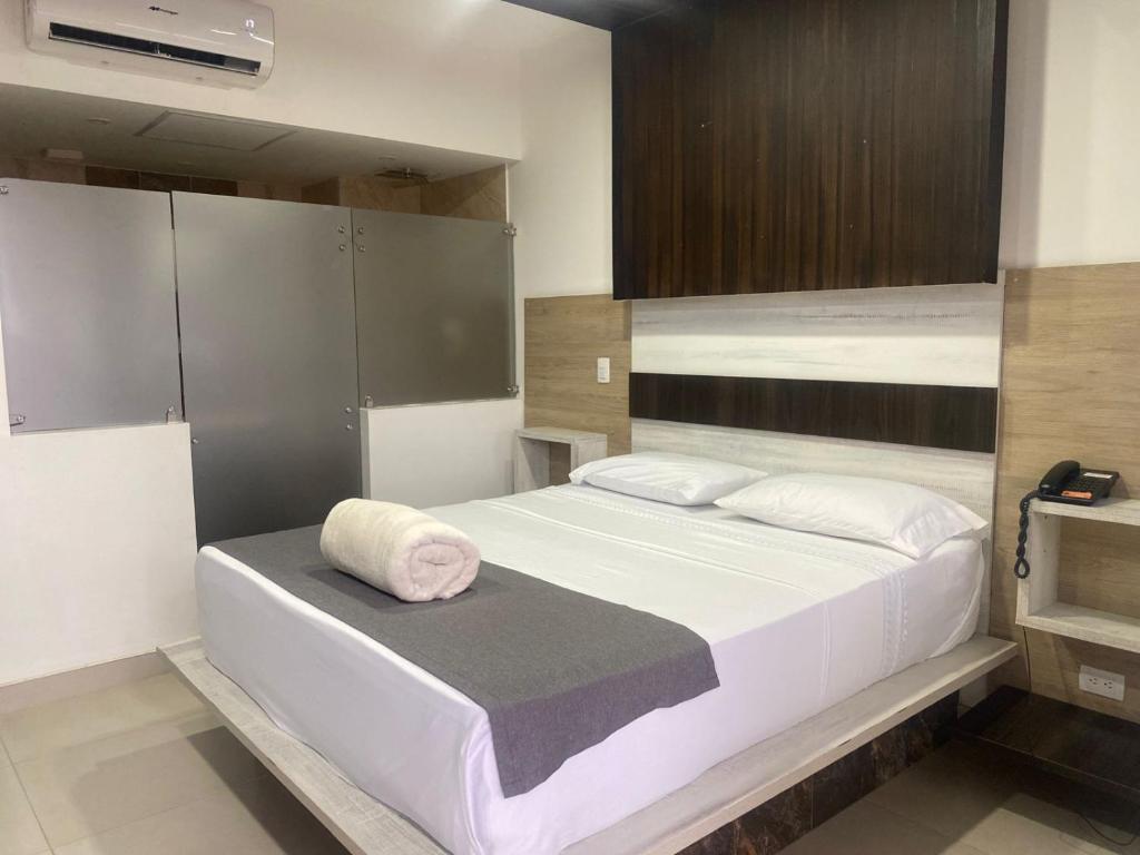 Ένα ή περισσότερα κρεβάτια σε δωμάτιο στο San Antonio Plaza