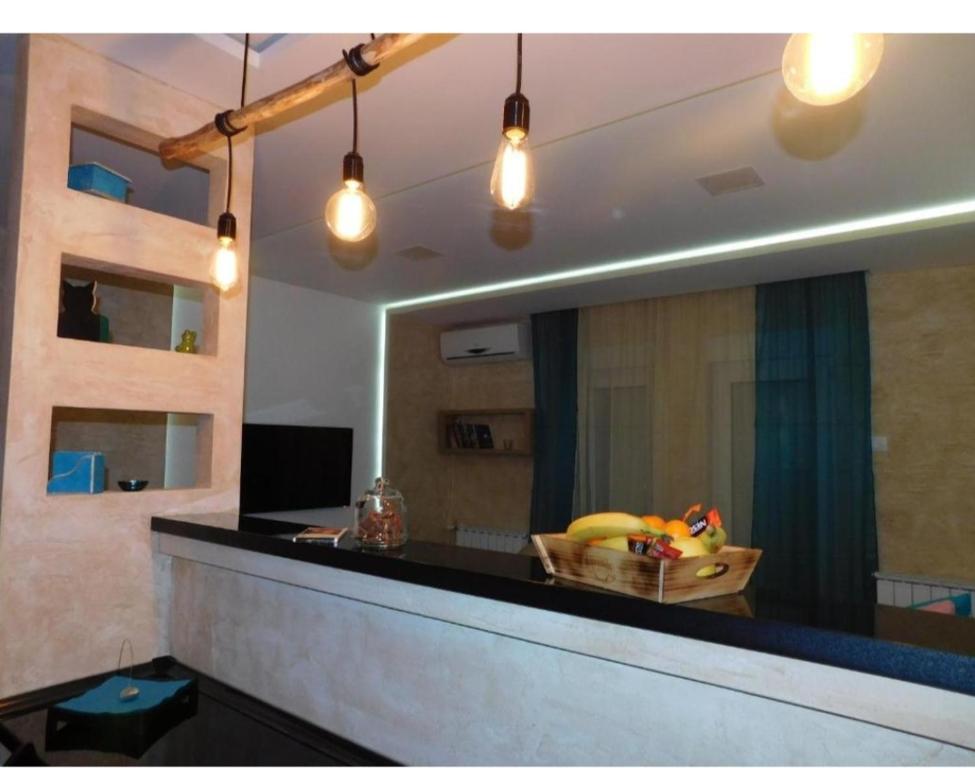 a bowl of fruit on a counter in a room at Apartman broj 19 in Banja Koviljača