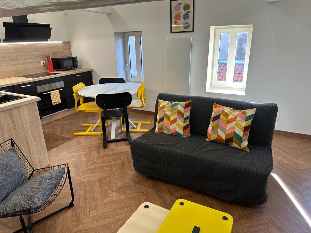 a living room with a couch and a table at LeLafayette in Metz