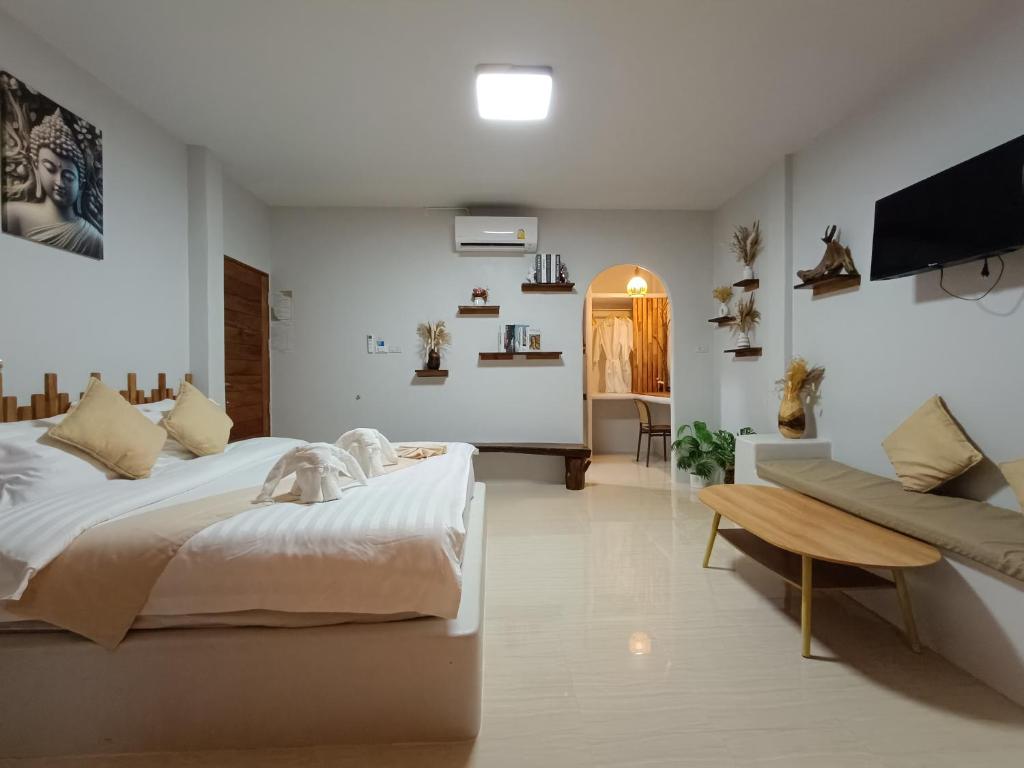 Postel nebo postele na pokoji v ubytování Marine House Koh Tao