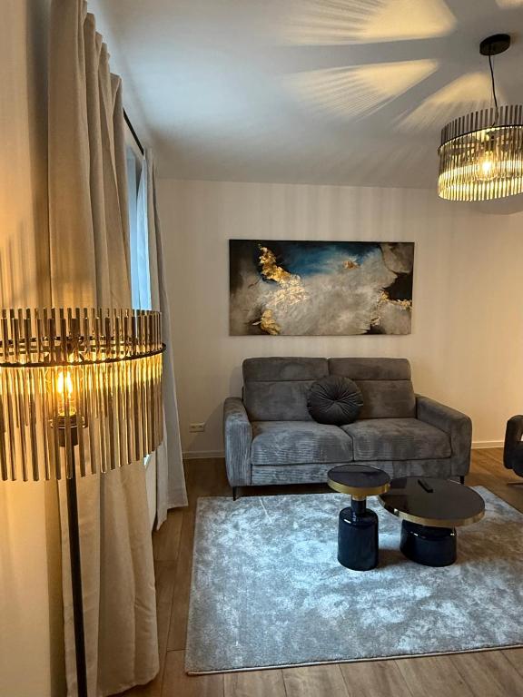 a living room with a couch and a table at Apartment Alana in Hannover