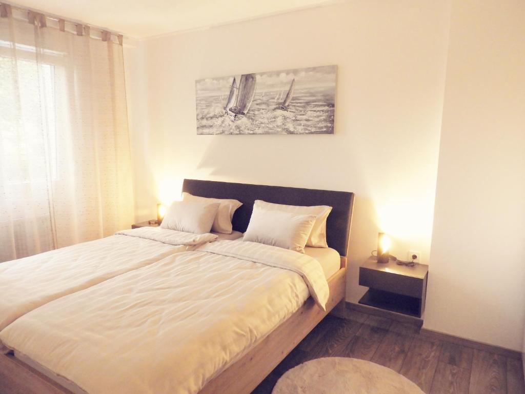 Postel nebo postele na pokoji v ubytování ONYX Apartments