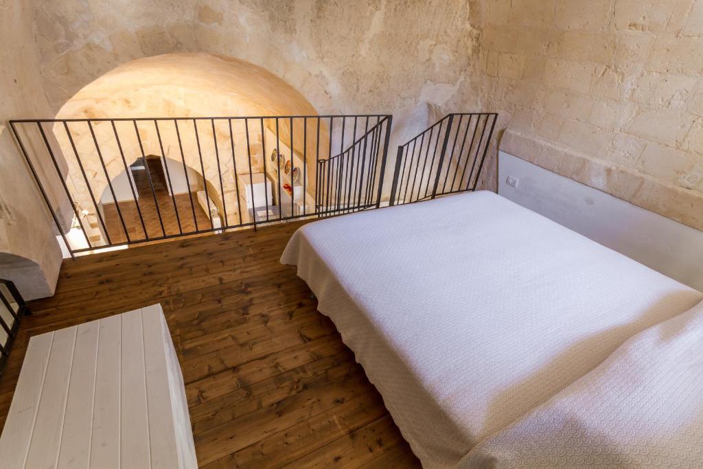 Postel nebo postele na pokoji v ubytování Casamata Matera