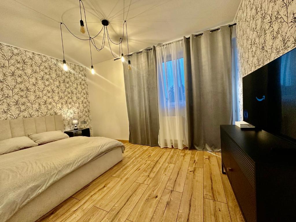 Μια τηλεόραση ή/και κέντρο ψυχαγωγίας στο Apart Izabelinska