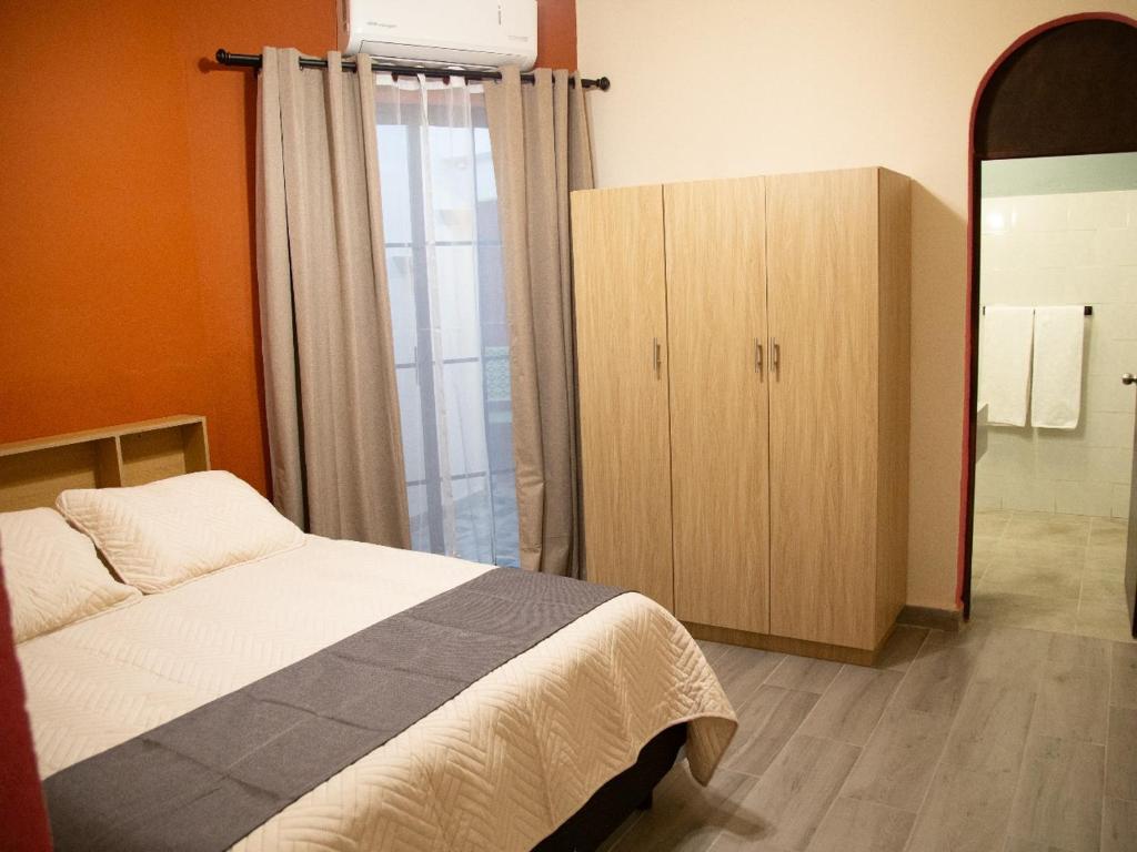 Postel nebo postele na pokoji v ubytování Privada Guadalupe