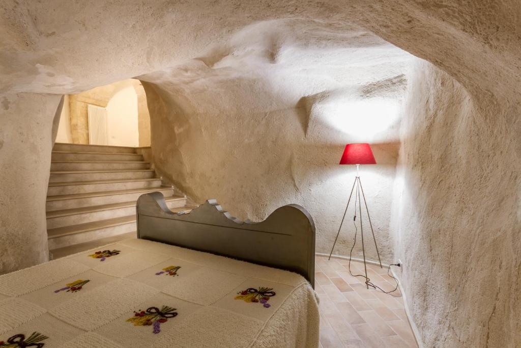 Postel nebo postele na pokoji v ubytování Casamata Matera