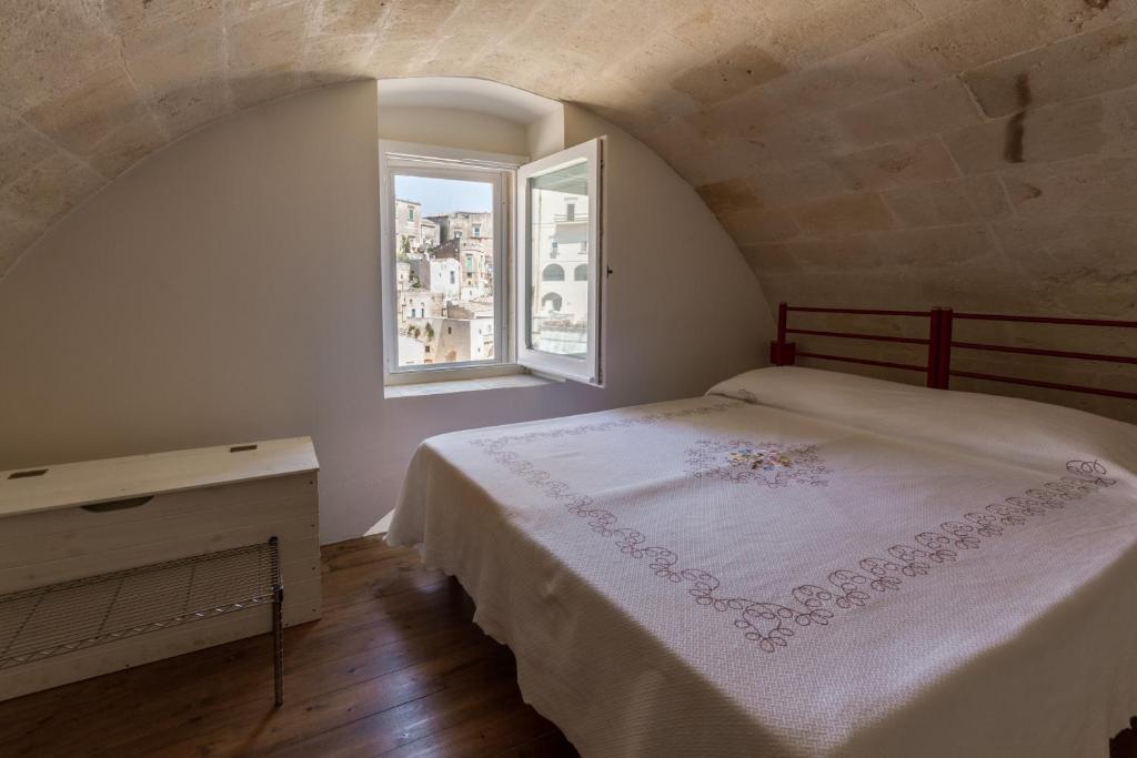 Postel nebo postele na pokoji v ubytování Casamata Matera