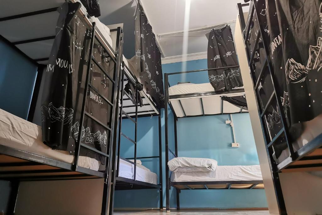 a room with several bunk beds in it at Harmony Backpackers Hostel in Batumi