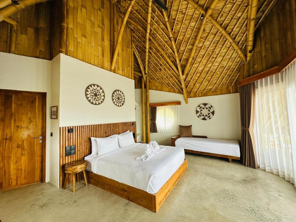 Postel nebo postele na pokoji v ubytování Green Poya Resort and Spa