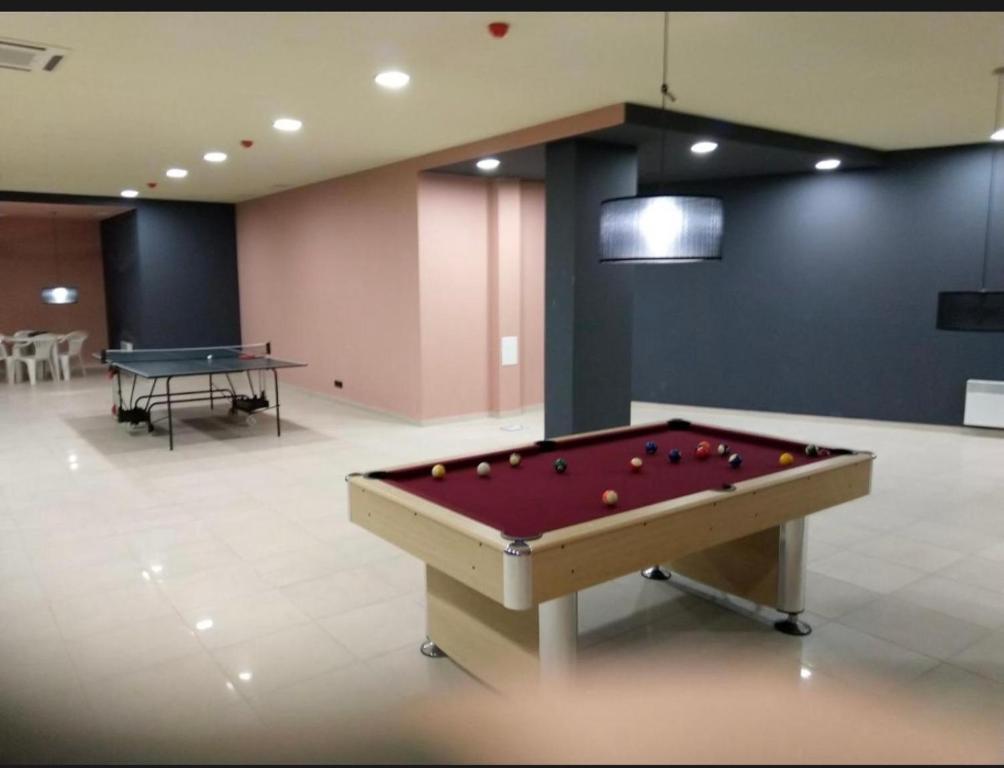 a pool table with balls on it in a room at Aspen Luxury Apartamnet in Razlog