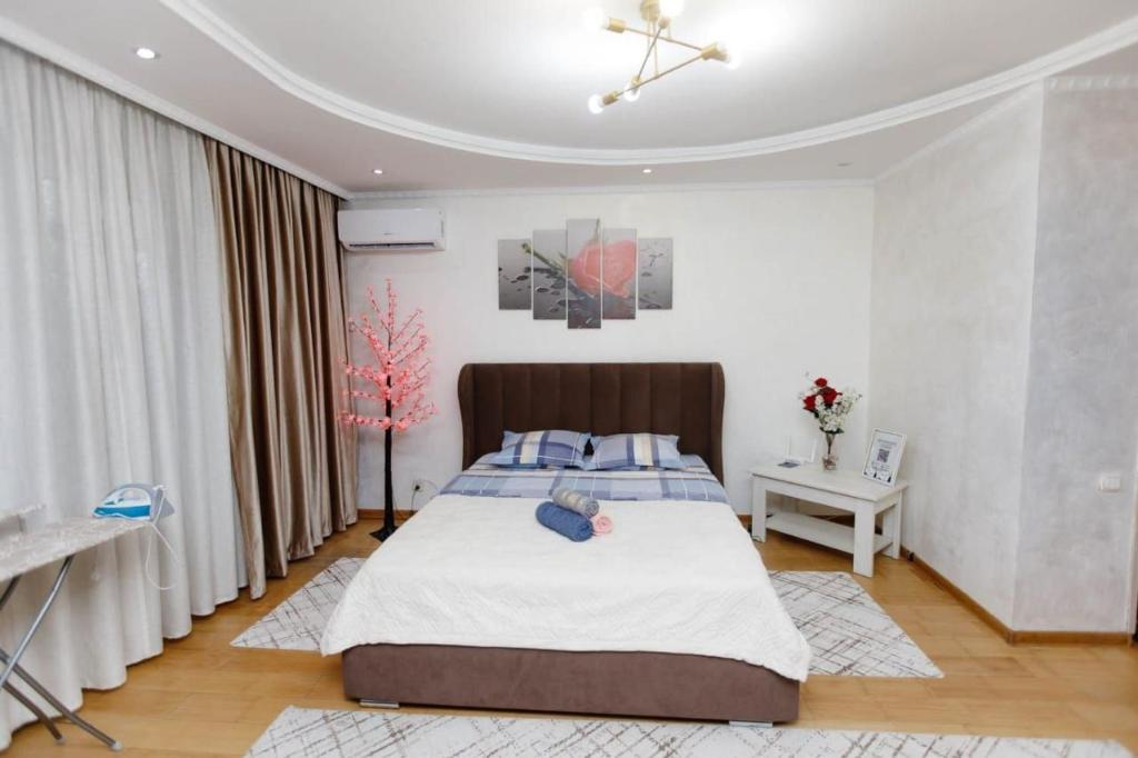 Ένα ή περισσότερα κρεβάτια σε δωμάτιο στο Уалих159