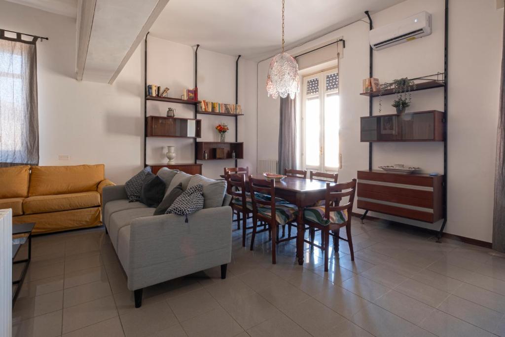 a living room with a couch and a table at san Lorenzo by the sea in Augusta