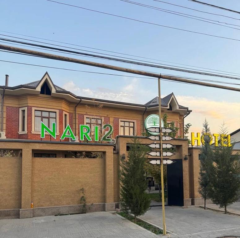 a narma store on the corner of a street at Nari 2 Hotel in Toshkent-Passajir Bekati