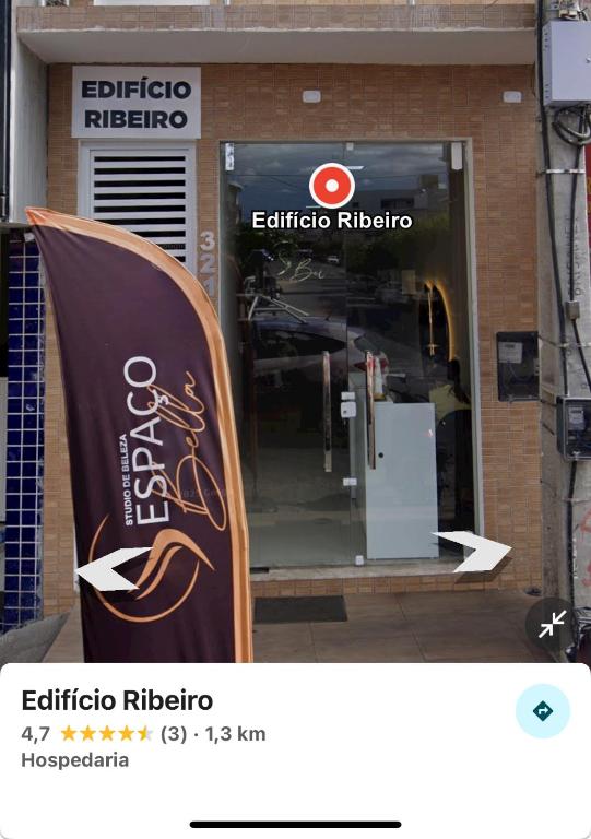 a store front with a sign in front of a store at Edifício Ribeiro in Patos