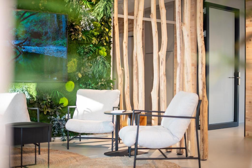 a room with three chairs and a table at RELAXANS Hotel in Dinkelsbühl