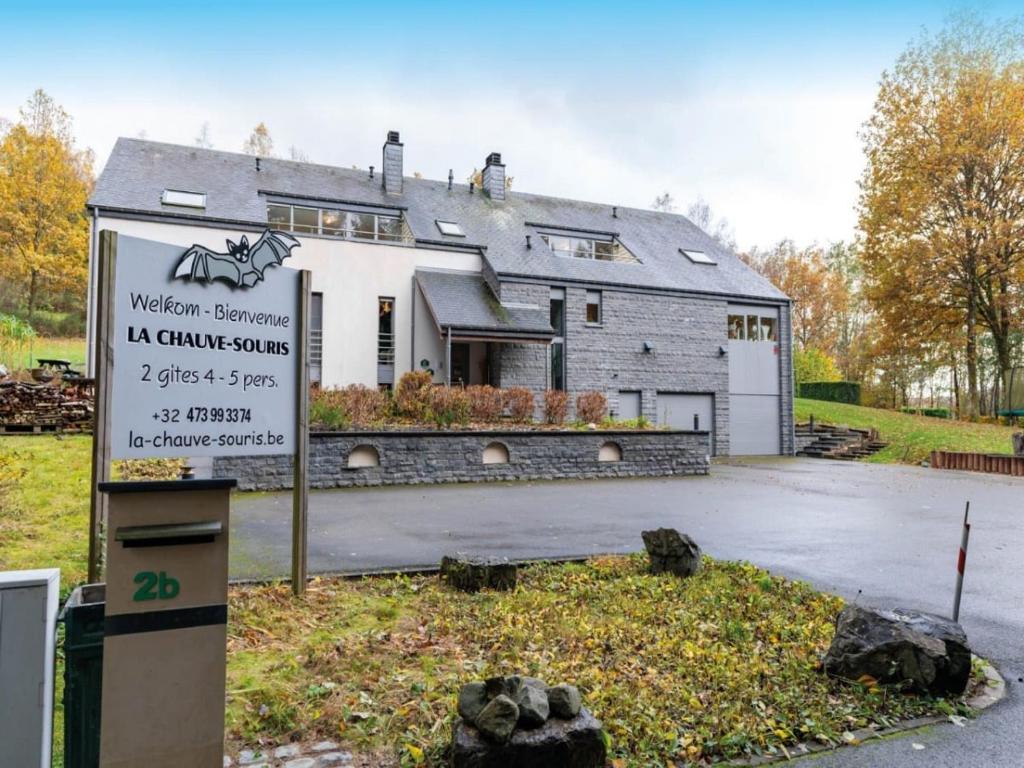 a house with a sign in front of it at Villa La Chauve Souris in Houffalize