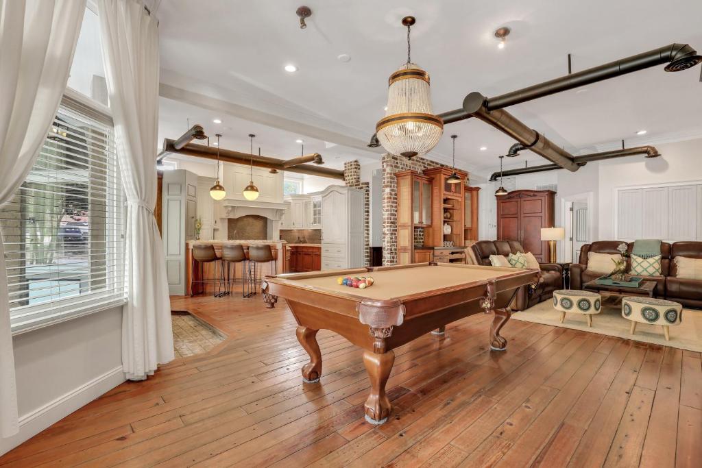 a living room with a pool table in it at Home at 1014 in Savannah