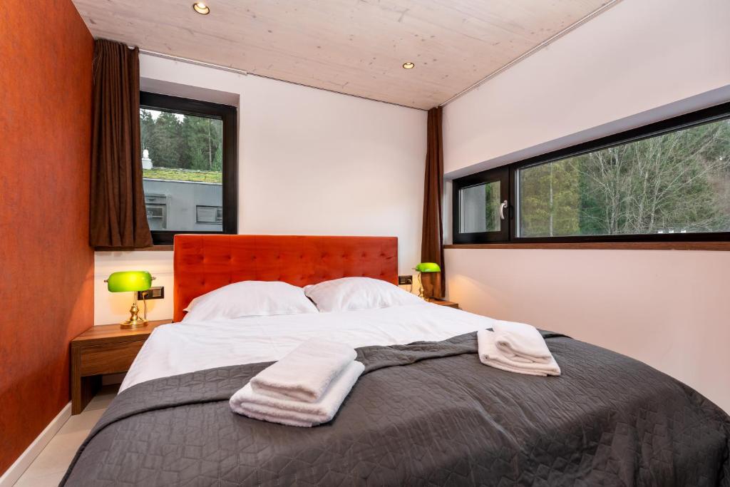 Postel nebo postele na pokoji v ubytování Apartmán SKIBIKE, Hrabovo