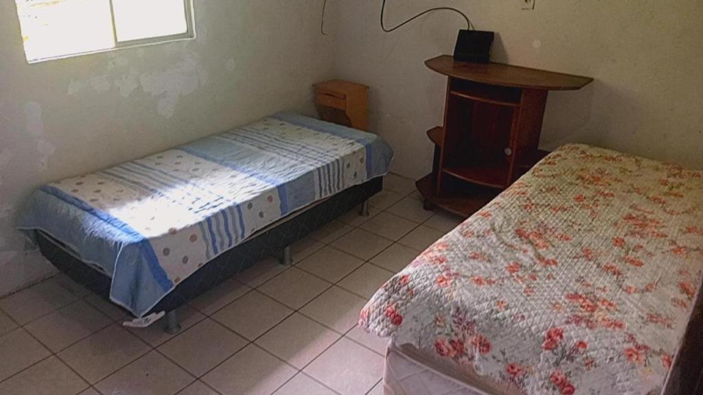 Ένα ή περισσότερα κρεβάτια σε δωμάτιο στο Casa Soares