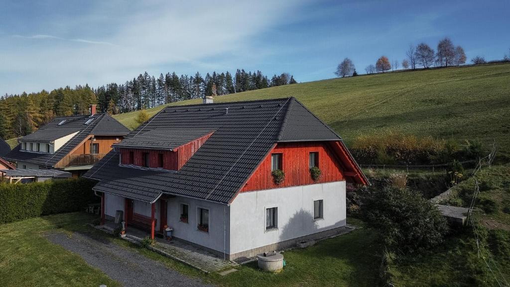 an overhead view of a house with black roof at U Oslíka in Zdíkov