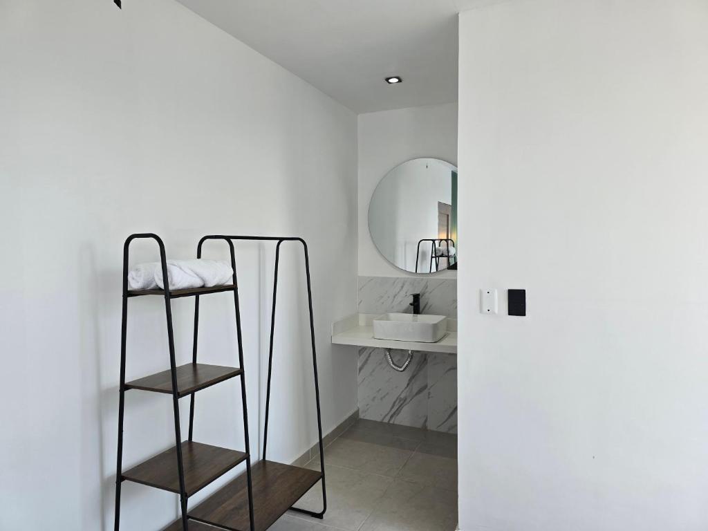 a bathroom with a sink and a mirror at View Theras Hotel in Doradal
