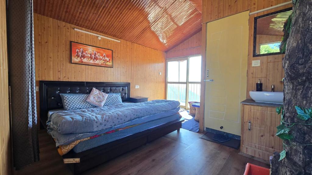a bedroom with a bed and a sink at TREE HOUSE BY THE CITY ESCAPE in Shimla