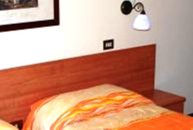 Postel nebo postele na pokoji v ubytování Hotel Delle Alpi