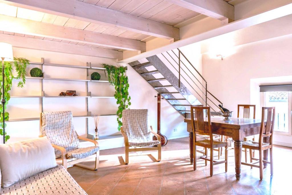 a dining room with a table and chairs at Luxe Paradise - 4 person, Historic Center in Modena