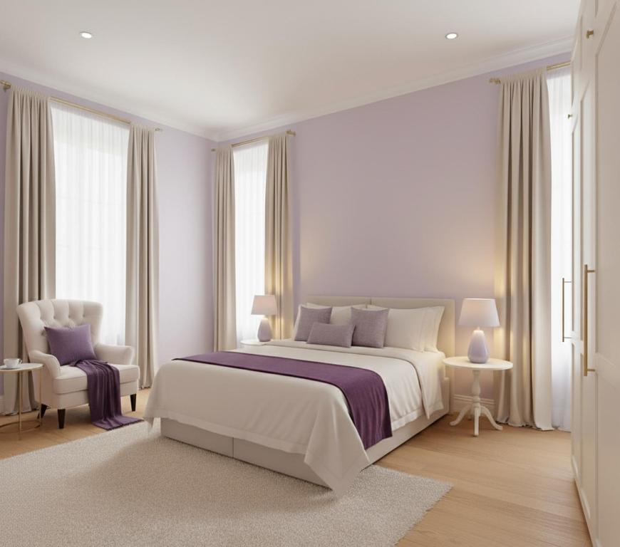 a white bedroom with a large bed and a chair at La-Sa Apart Hotel in Icmeler