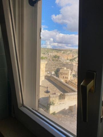 an open window with a view of a city at Labanca's La Perla in Matera