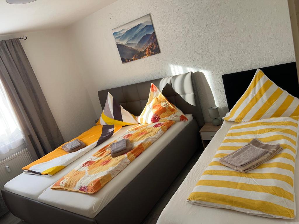 two beds sitting next to each other in a room at Wohnung VS in Villingen-Schwenningen